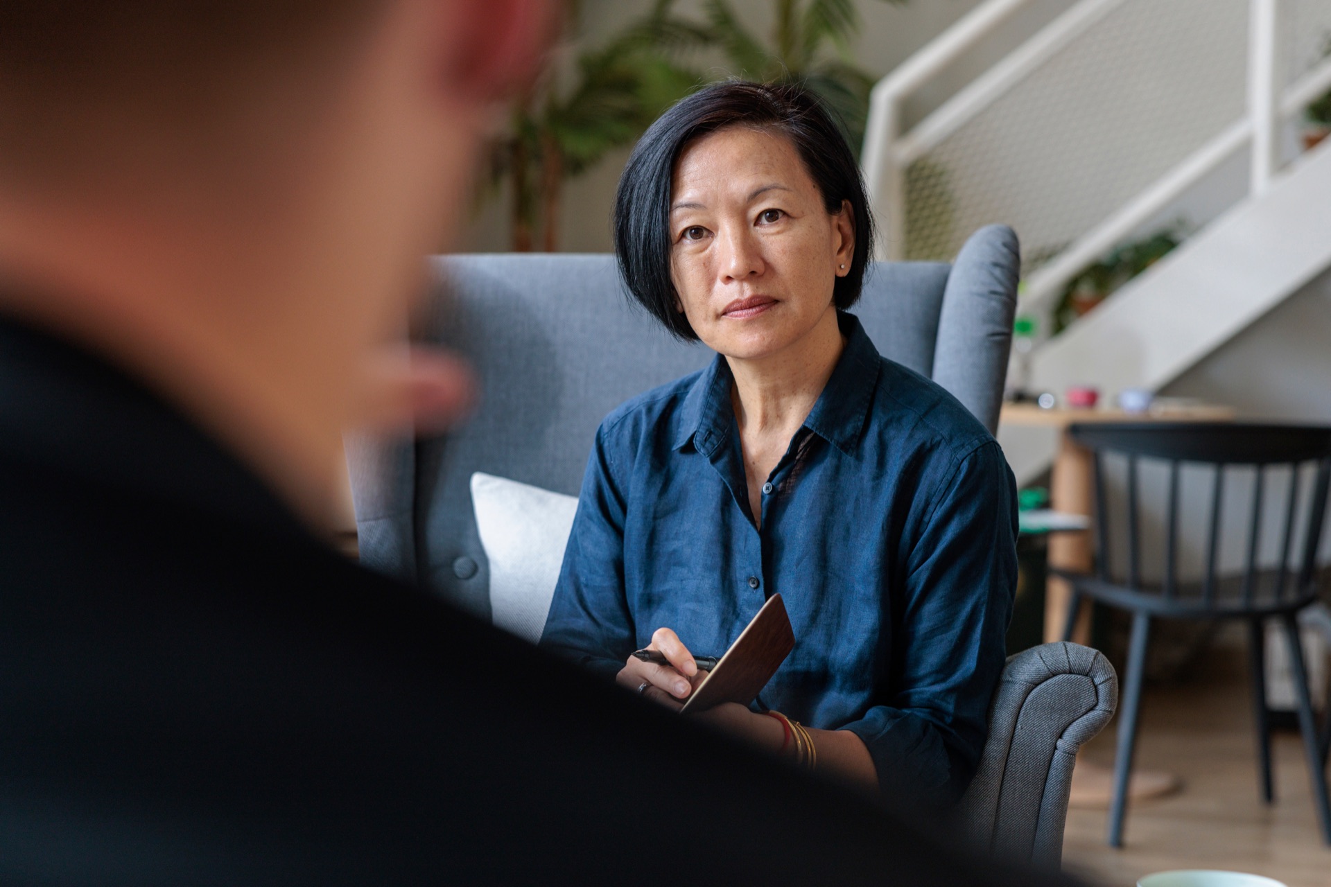 A clinician listening attentively during a therapy session